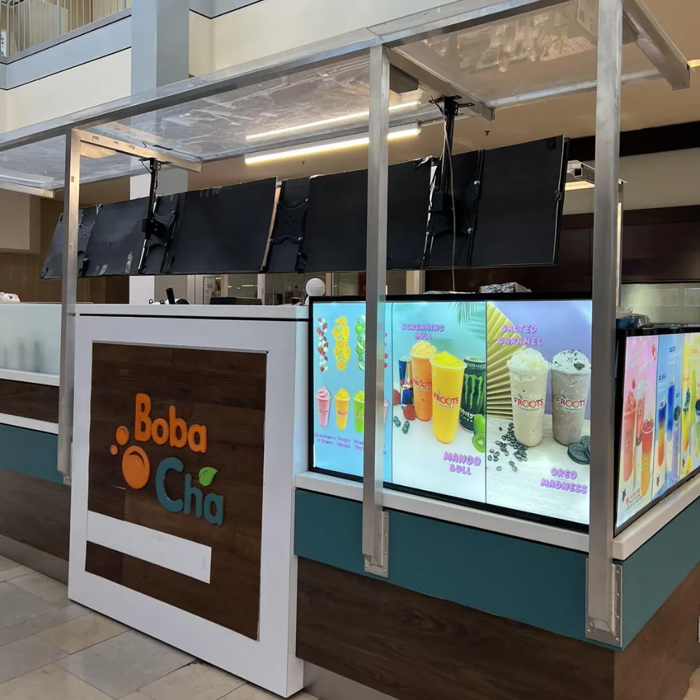 Boba Cha shop front with menu displays at BoBa Cha Bubble Tea & Smoothies House, a Cafe in Baltimore