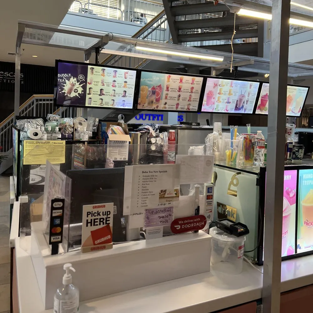 Boba tea shop counter with menus and supplies at BoBa Cha Bubble Tea & Smoothies House, a Cafe in Baltimore